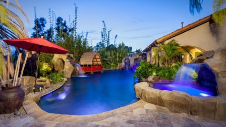 Pool with waterfalls by Distinguished Pools