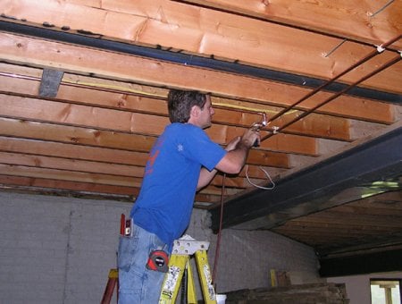 Plumber working on pipes