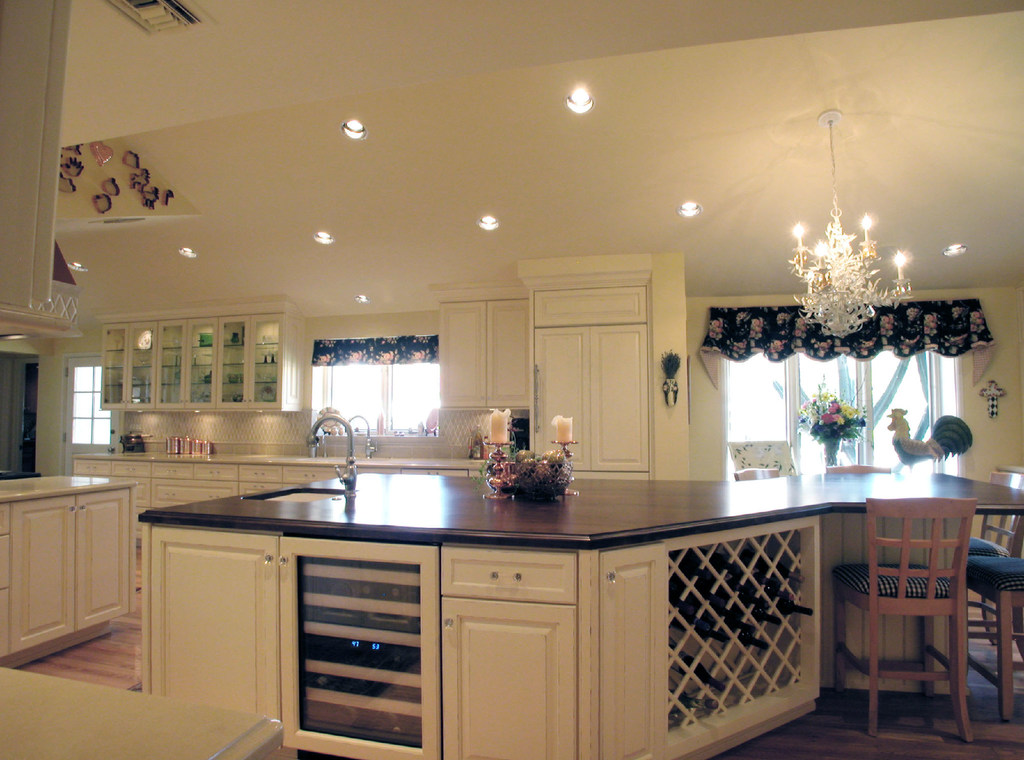 Great kitchen island with built-in wine rack and wine fridge