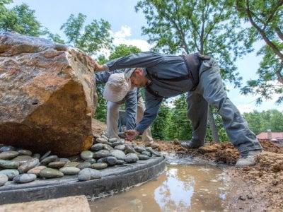 Top 10 Best Miami Fl Fountain Installers Angie S List Landscapers Placing Smooth Gray Decorative Stones Around The Base Of A 1 Ton Bubbling Boulder