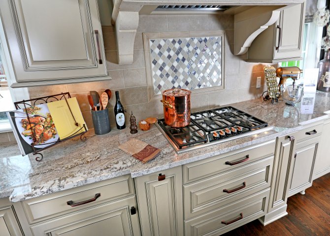 Kitchen With Granite Countertops And Tile Backsplash