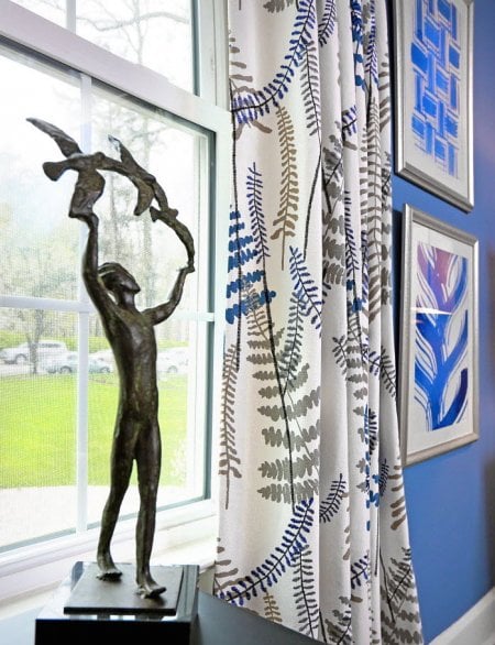 patterned curtains with statuette