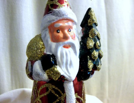 Santa Claus figurine with tree