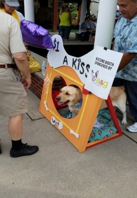 A kissing dog booth in Angie's List Gardens at the Indiana State Fair