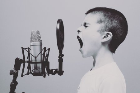kid singing into mic kid singing into mic