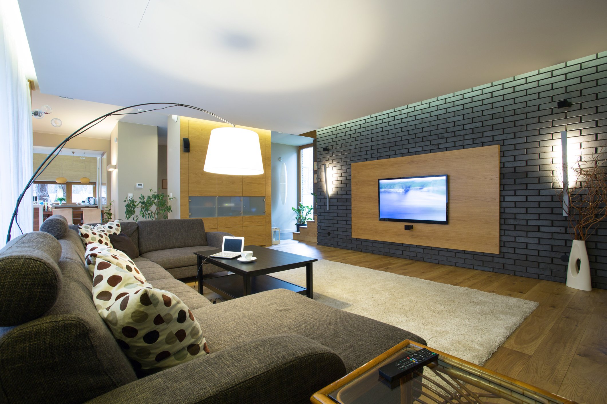Living Room Lighting Ideas Brick wall in modern spacious drawing room