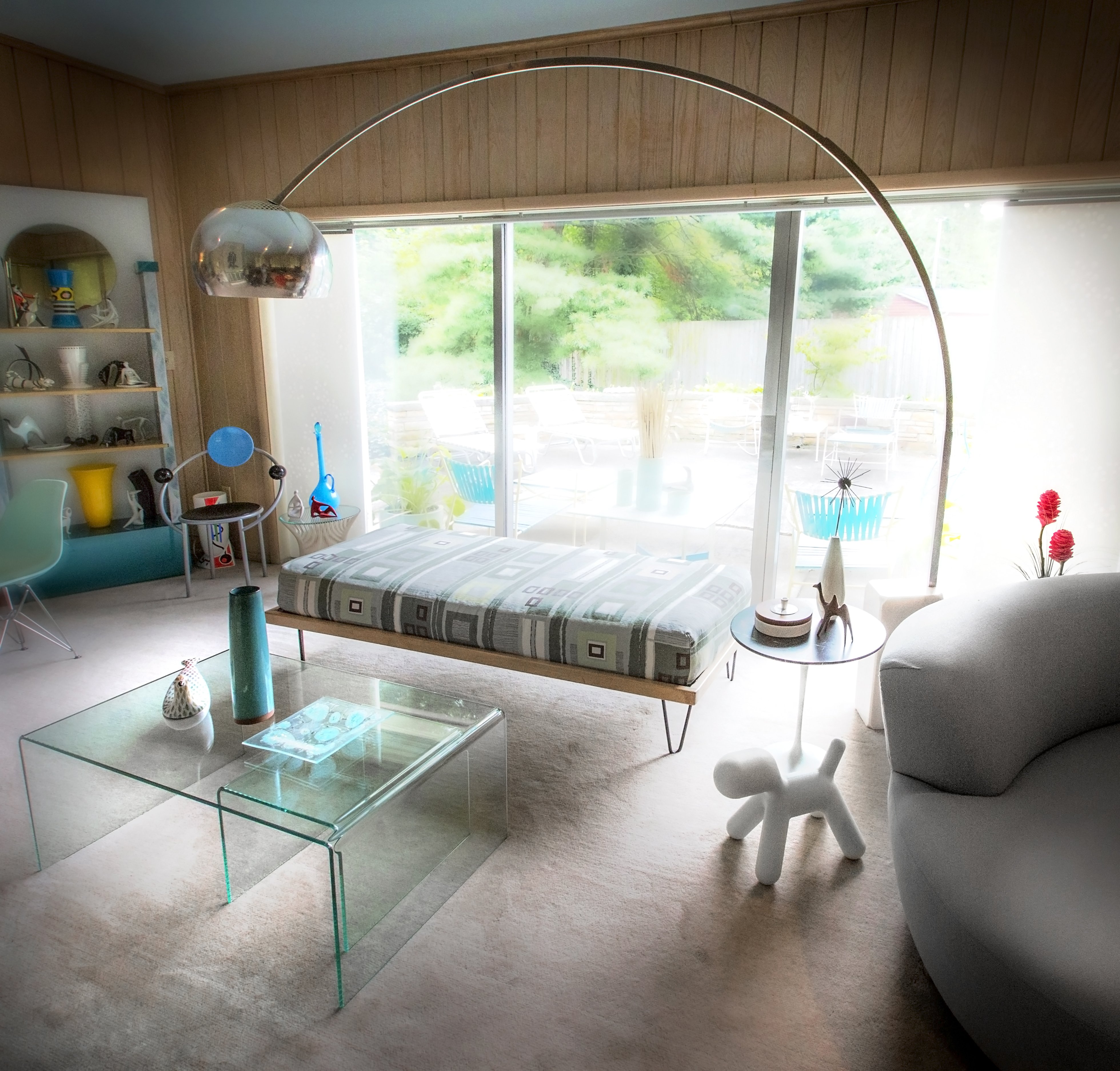 Living Room Lighting Ideas An overall of a portion of the spacious living room, complete with a classic Italian arch floor lamp within the Cohen Mid-Century Modern home.