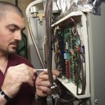 technician installing dehumidifier