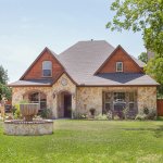 exterior of home with stone and stained wood siding