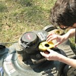 lawn mower being fixed