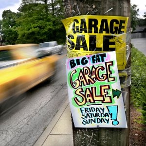 garage sale signs on a telephone pole