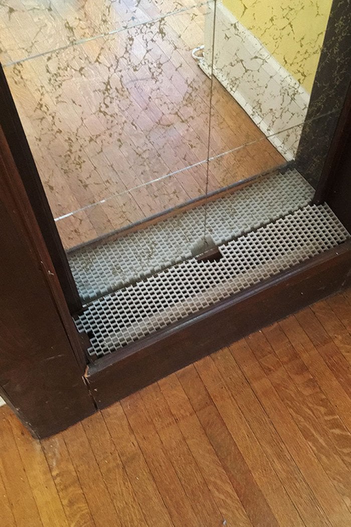 mirror inset on painted fireplace before makeover