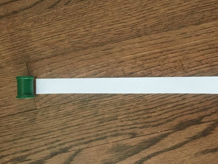 Spool and paper strip