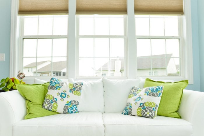 Brightly colored or uniquely patterned pillow instantly change a room and can be regularly swapped throughout the year. (Photo by Summer Galyan)