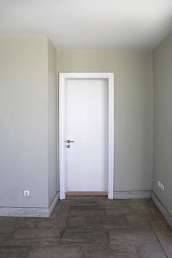 white door with draft stopper along bottom