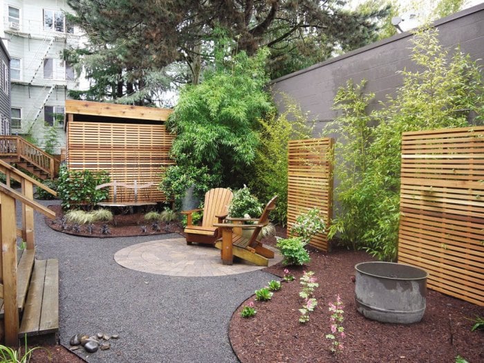 Backyard with stone, wood and plant features