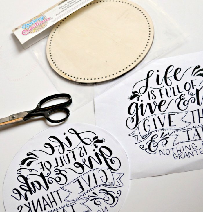Trace the round plaque onto printed sign and cut out the shape so everything aligns. (Photo by Abbey DeHart/The Cards We Drew)