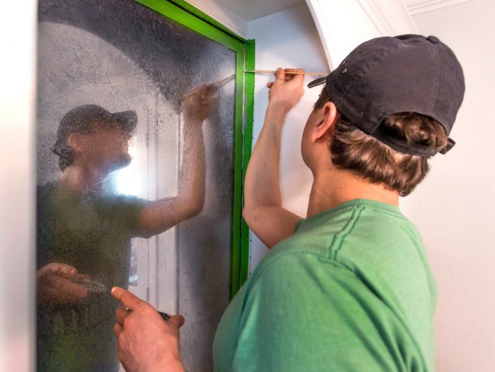 Silver Crow Studios' David Studley creating a faux antique mirror