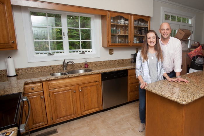 couple in kitchen with outdated look