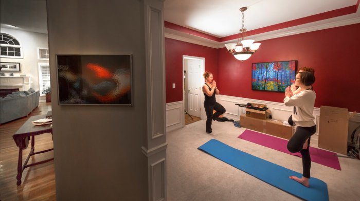 Women doing yoga in dining room space
