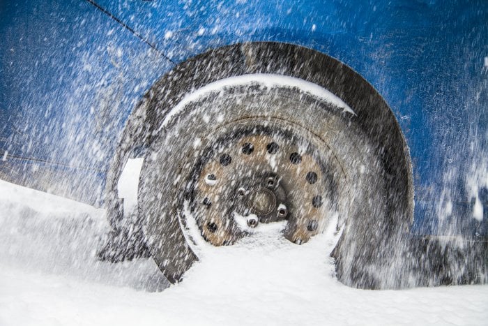 a car wheel spinning in snow