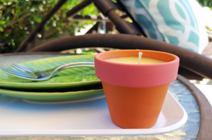 Small clay jars work nicely, but you can use any holder that will withstand heat, such as glass jars or tin cans. (Photo courtesy of Dinah Wulf/DIY Inspired)