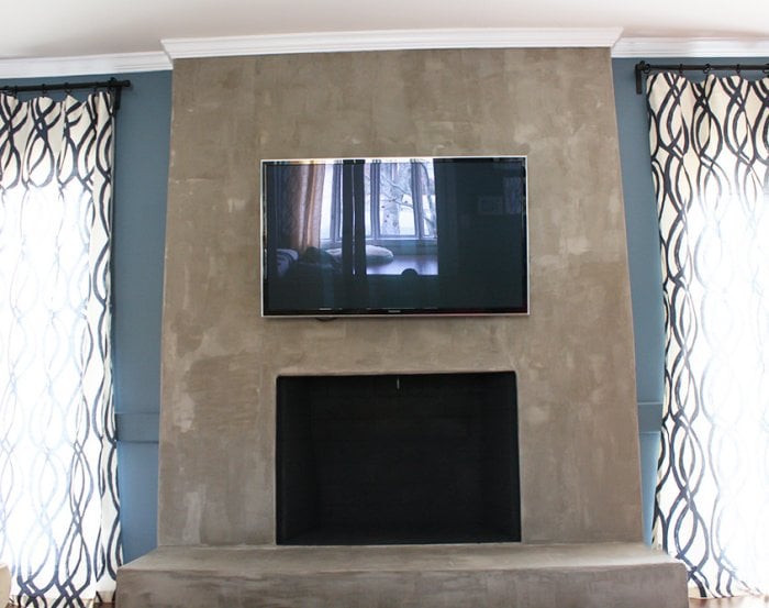 Concrete Industrial Fireplace Remodel Meets Cozy Chic Angie S List Concrete Fireplace Mounted Tv