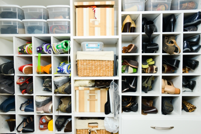 cubbies in closet full of shoes