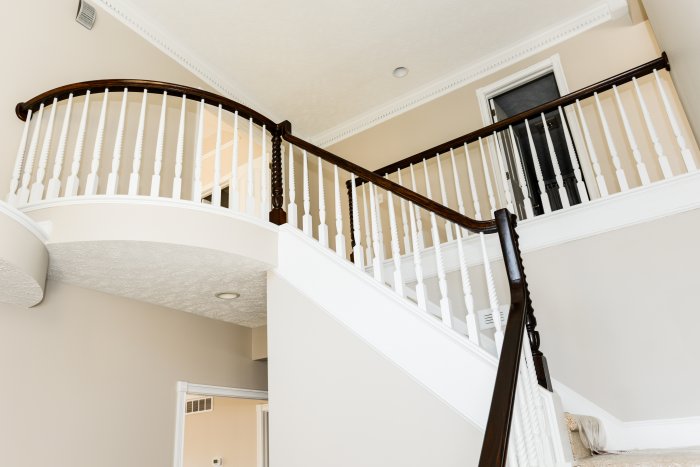 stairway balcony black rail white stairs entry in foyer (Photo by Summer Galyan)