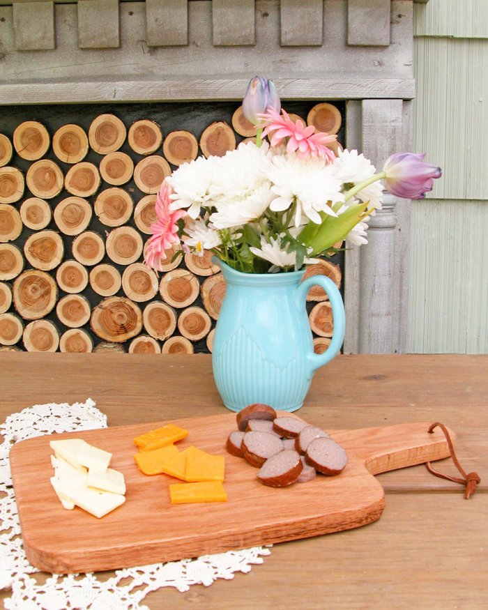 cutting board with meat and cheese