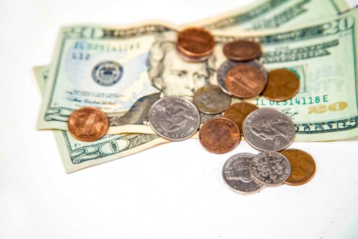 A stack of bills and coins