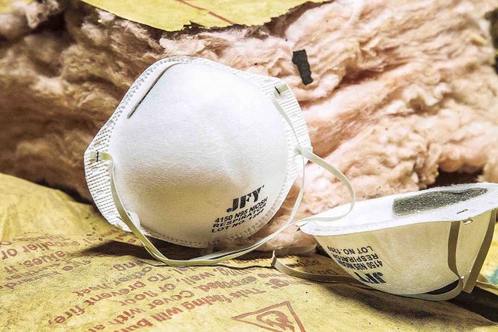 fiberglass insulation with dust masks