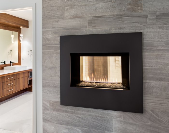 Double-sided glass fireplace used as room divider