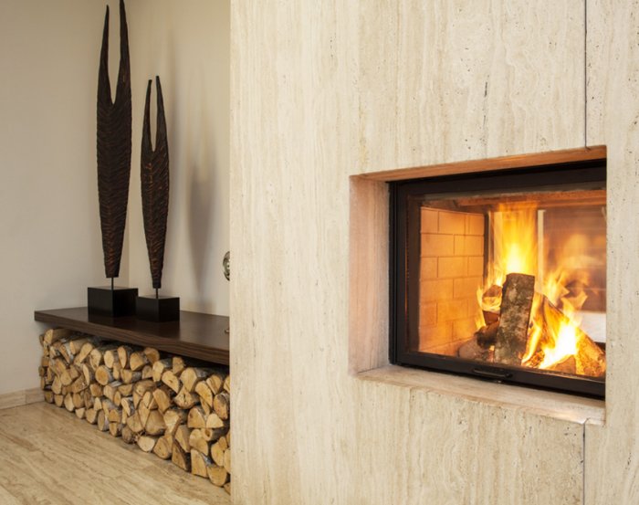 Wood-burning fireplace with wood stored on side