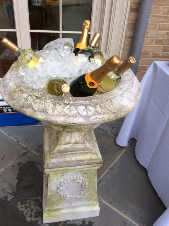 garden urn holding champagne and wine