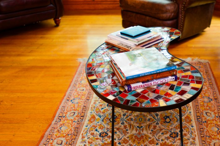 wood flooring and coffee table on rug