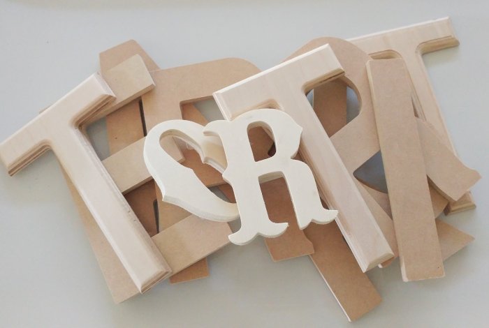 unfinished wooden letters