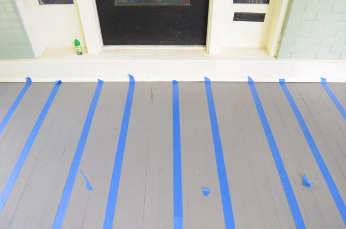 adding painters' tape to porch