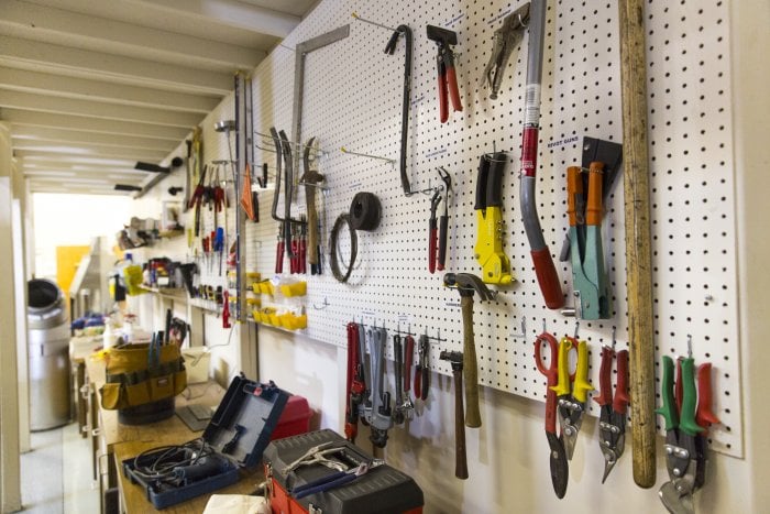 pegboard wall with tools above workbench (Photo by Eldon Lindsay)