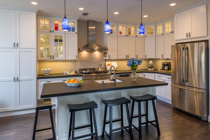 kitchen with stacked cabinets and island