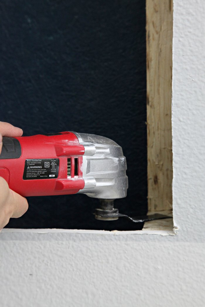 Carefully remove a portion of the wall stud. (Photo courtesy of Jennifer Jones/iHeart Organizing)