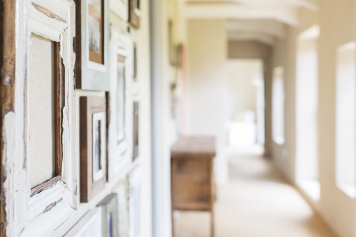 Hallway with photos hanging on wall. Hallway with photos hanging on wall.