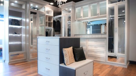 Large walk-in closet by California Closets