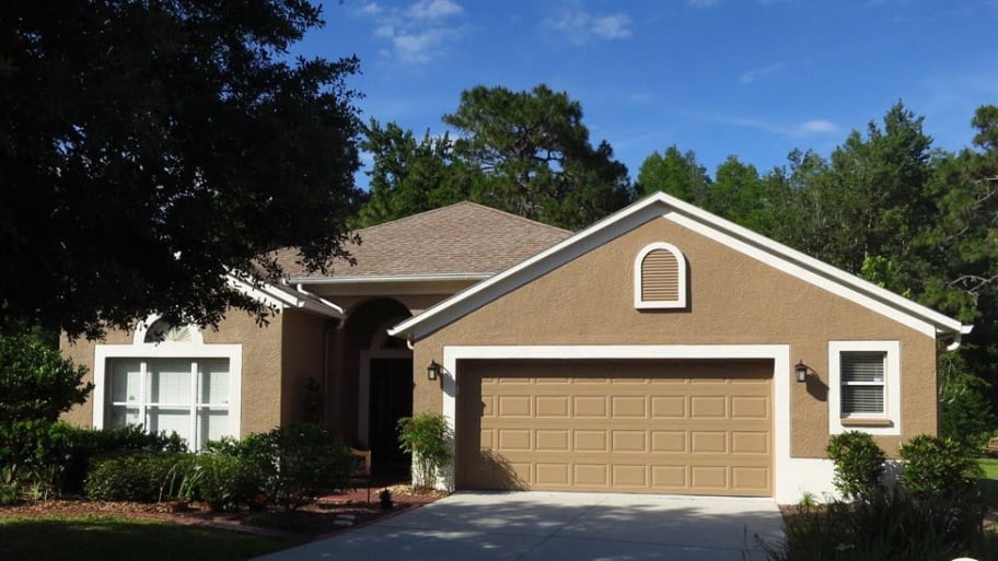 a brown house with white trim
