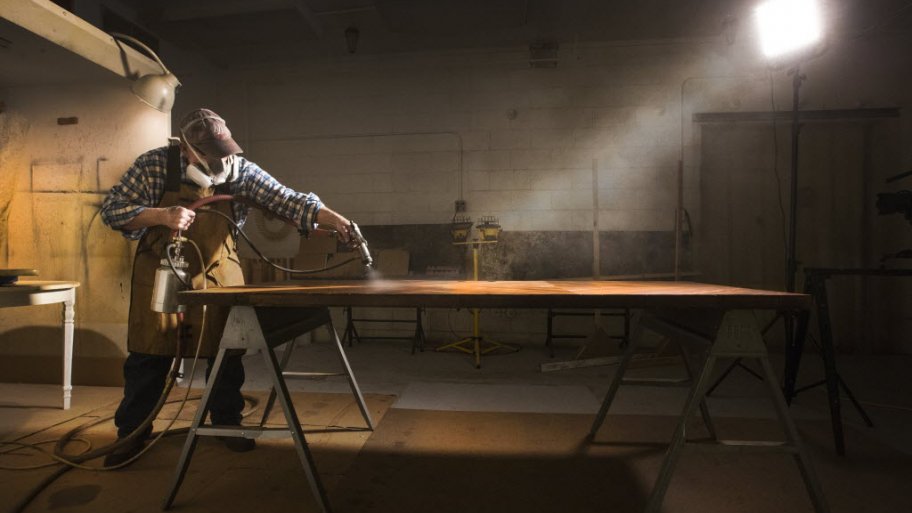 Greg Doublestein of The Front Gate in Indianapolis works on a door