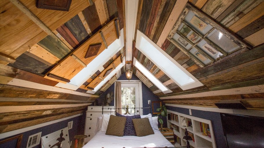 a bedroom with many panels of reclaimed wood in savannah georgia