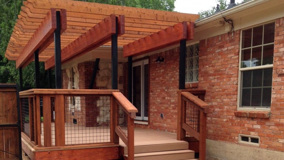 a brick home with a partially-covered front porch