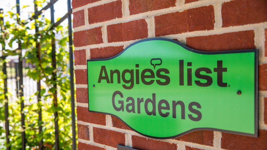 Green Angie's List Gardens sign on brick wall at Indiana State Fair