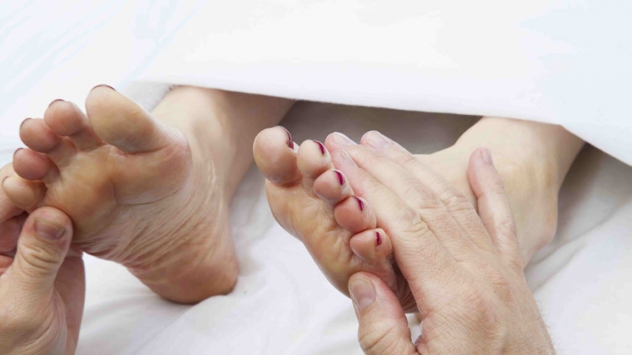 a foot doctor working on a patient