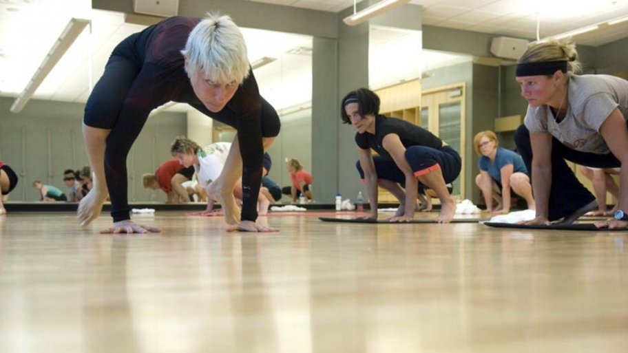 People doing Yoga in a Yoga studio